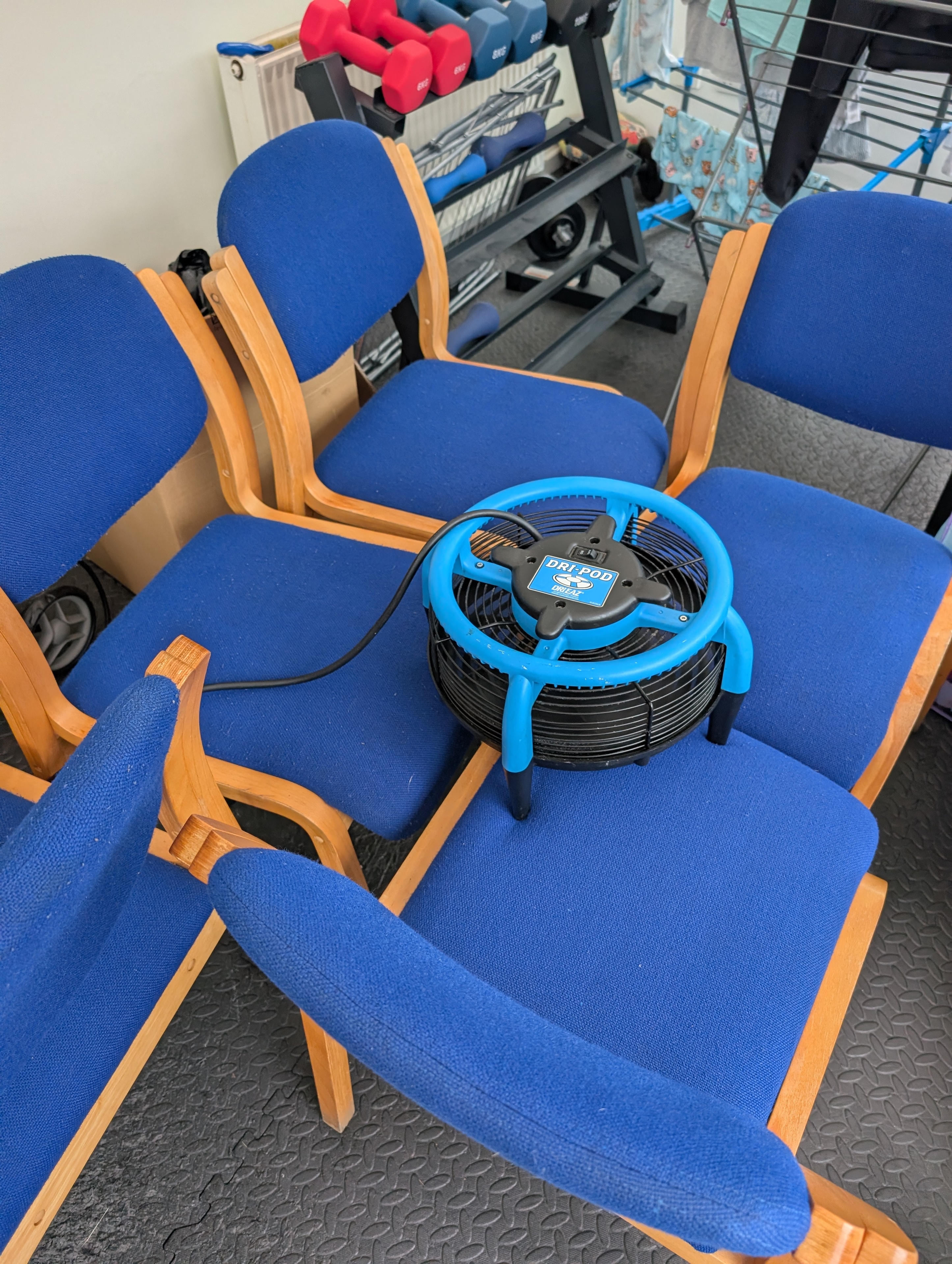 Canteen chairs drying with professional drying equipment after upholstery clean